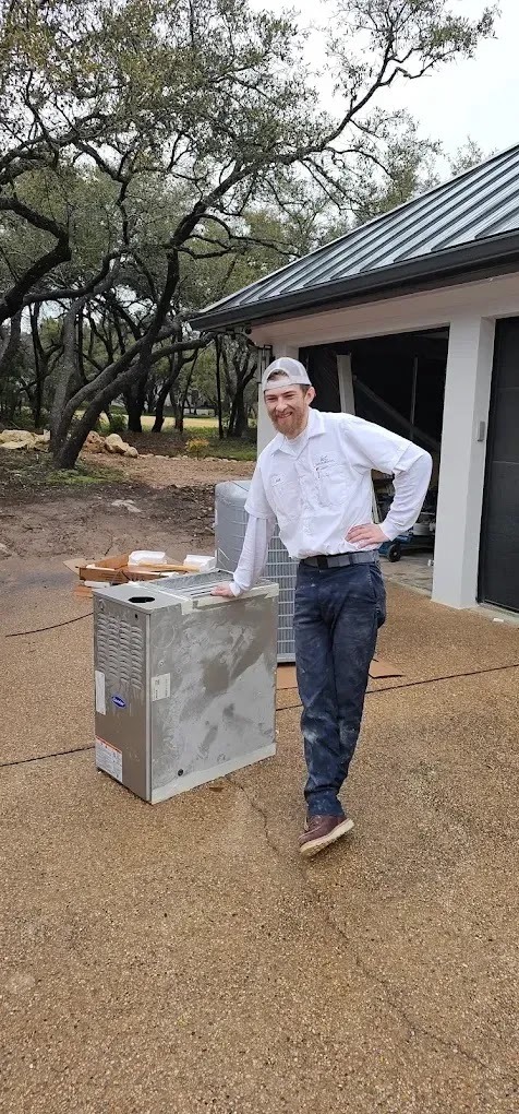 Homeowner diagnosing AC problems by checking thermostat and air filters