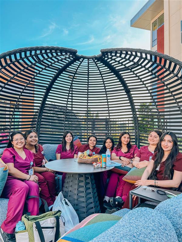 students sitting outside 