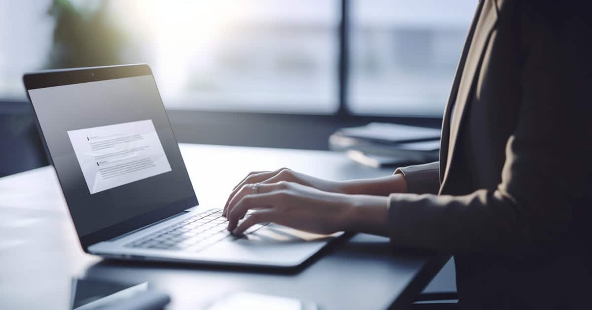 Worker setting their email signature on their computer.