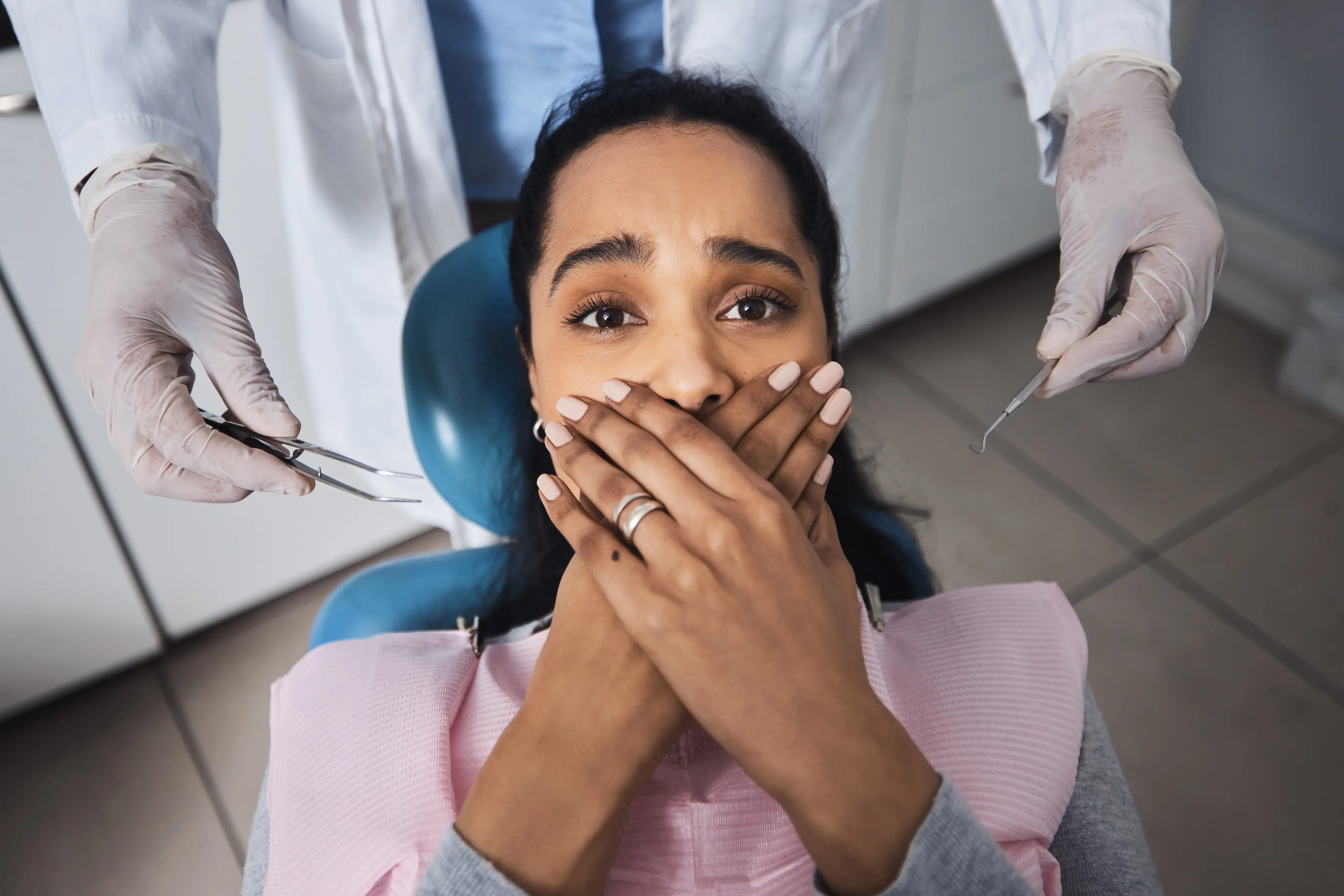 Anxious patient sitting in the dental chair before treatment