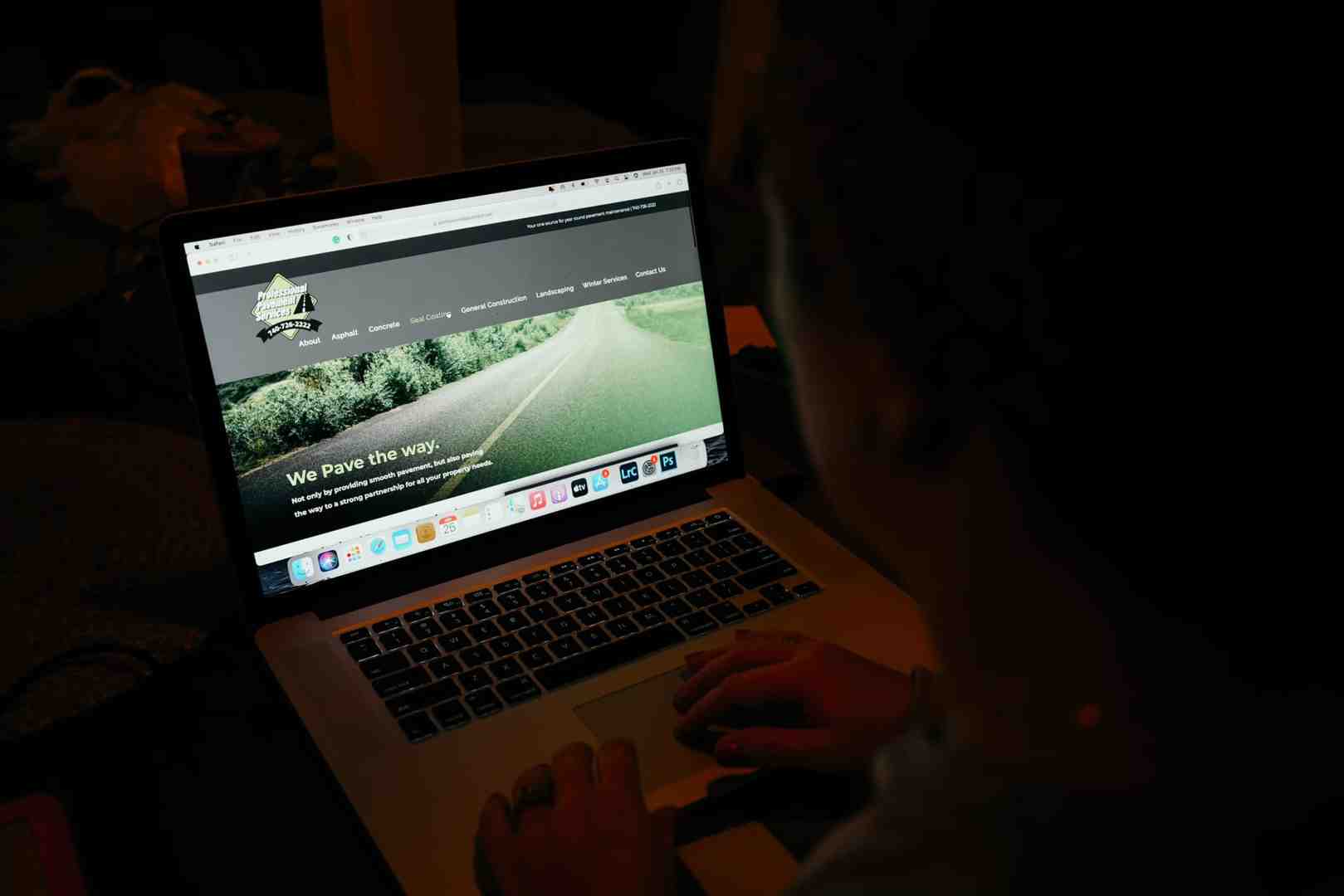 Person reading landscaping reviews on a tablet or phone - landscaping reviews Columbus OH