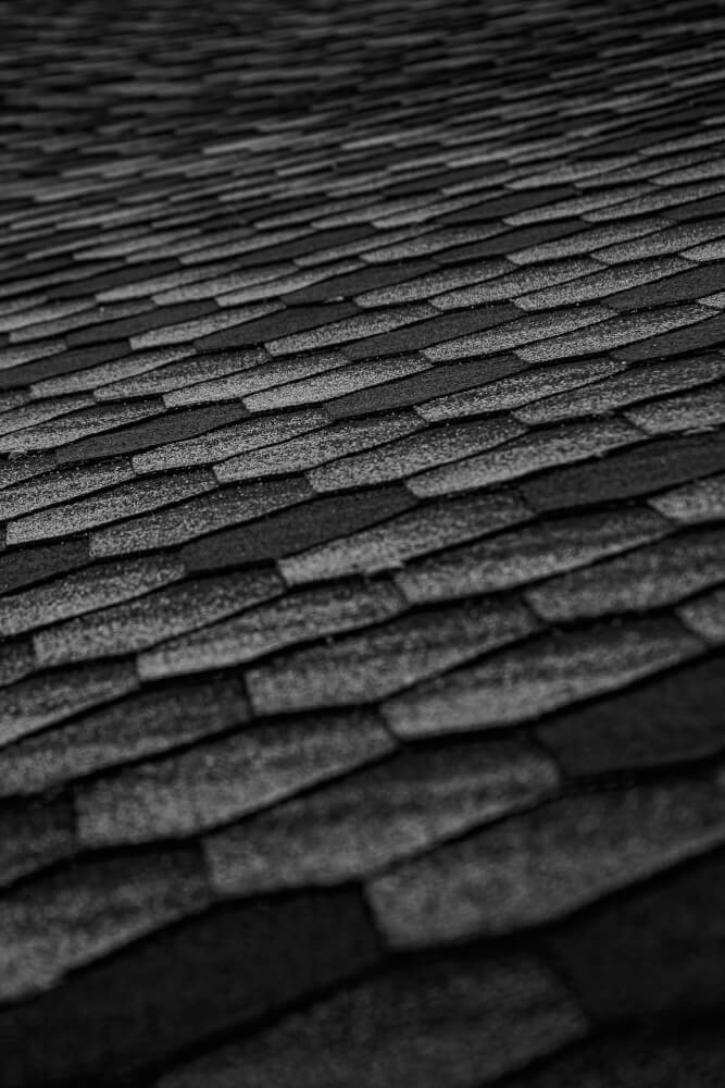 roof with overlapping asphalt shingles