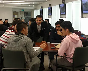Ivan Wanis Ruiz coaching a financial services team through a client conversation in a live training session