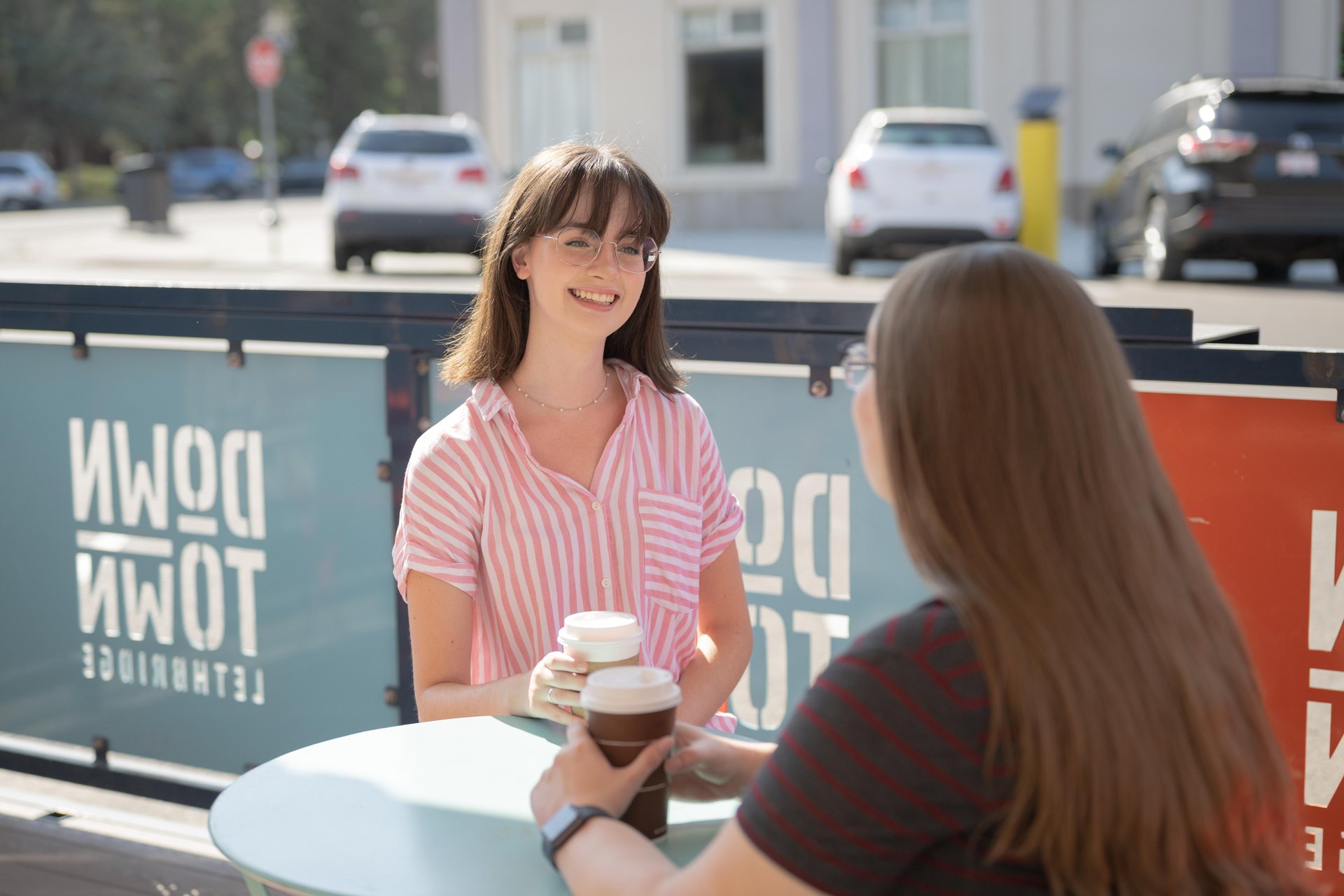 People drinking coffee and exploring things to do in Lethbridge