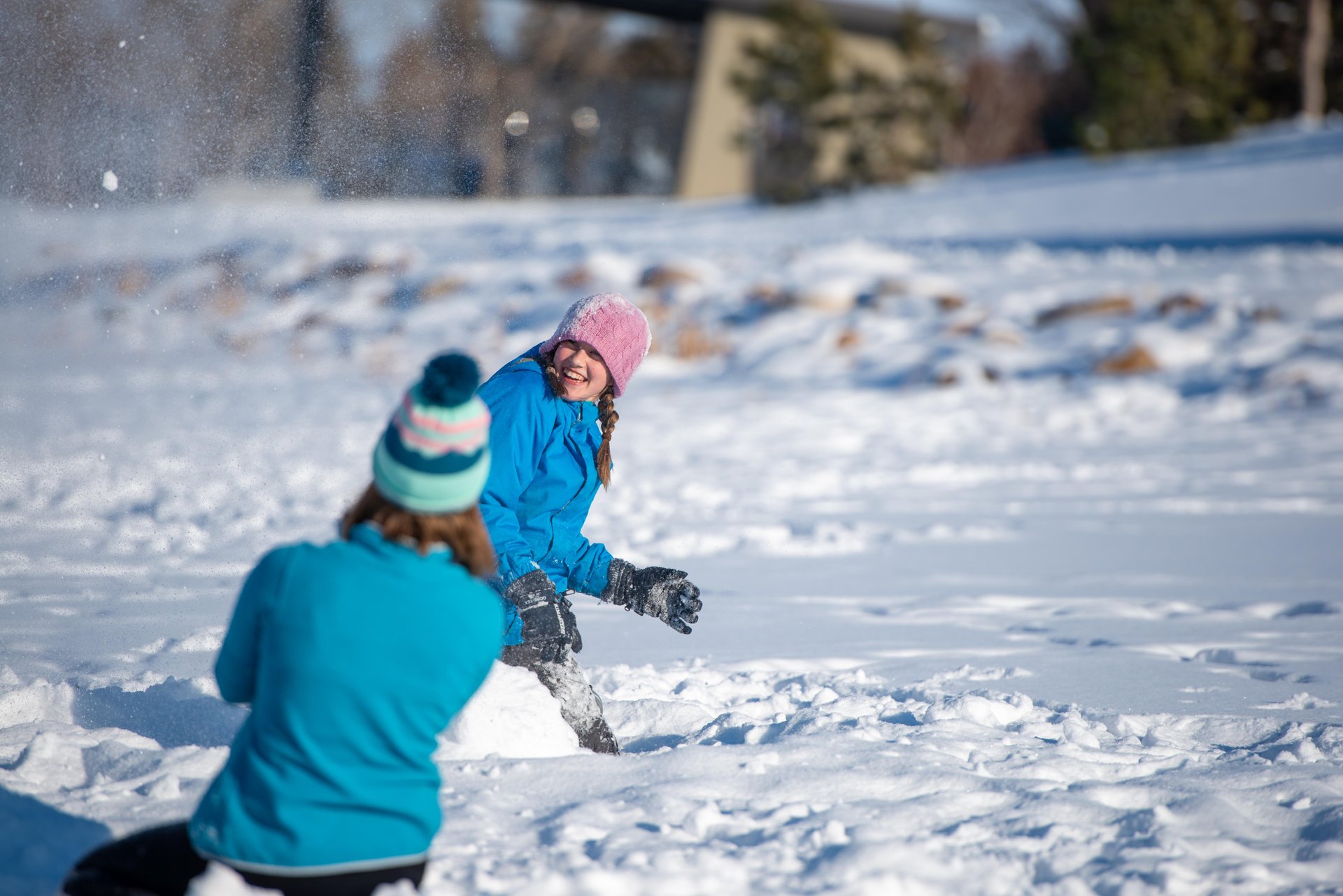 kids playing in the snow in Lethbridge