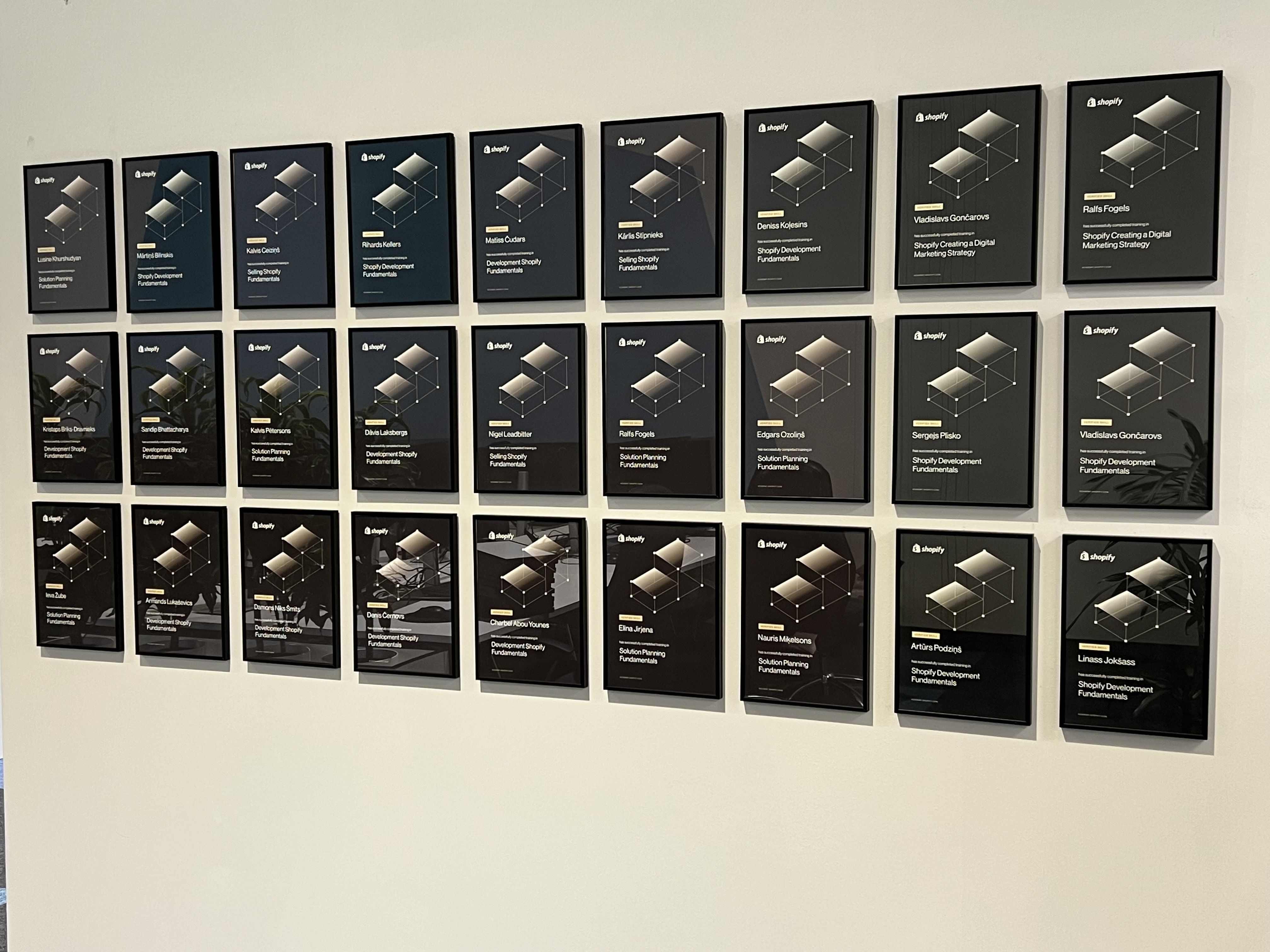 Wall with Shopify certificates at Magebit Office
