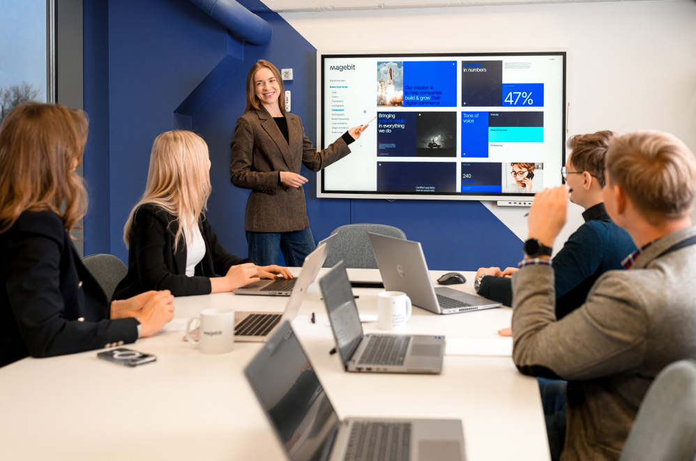 Magebit employees at a team meeting.
