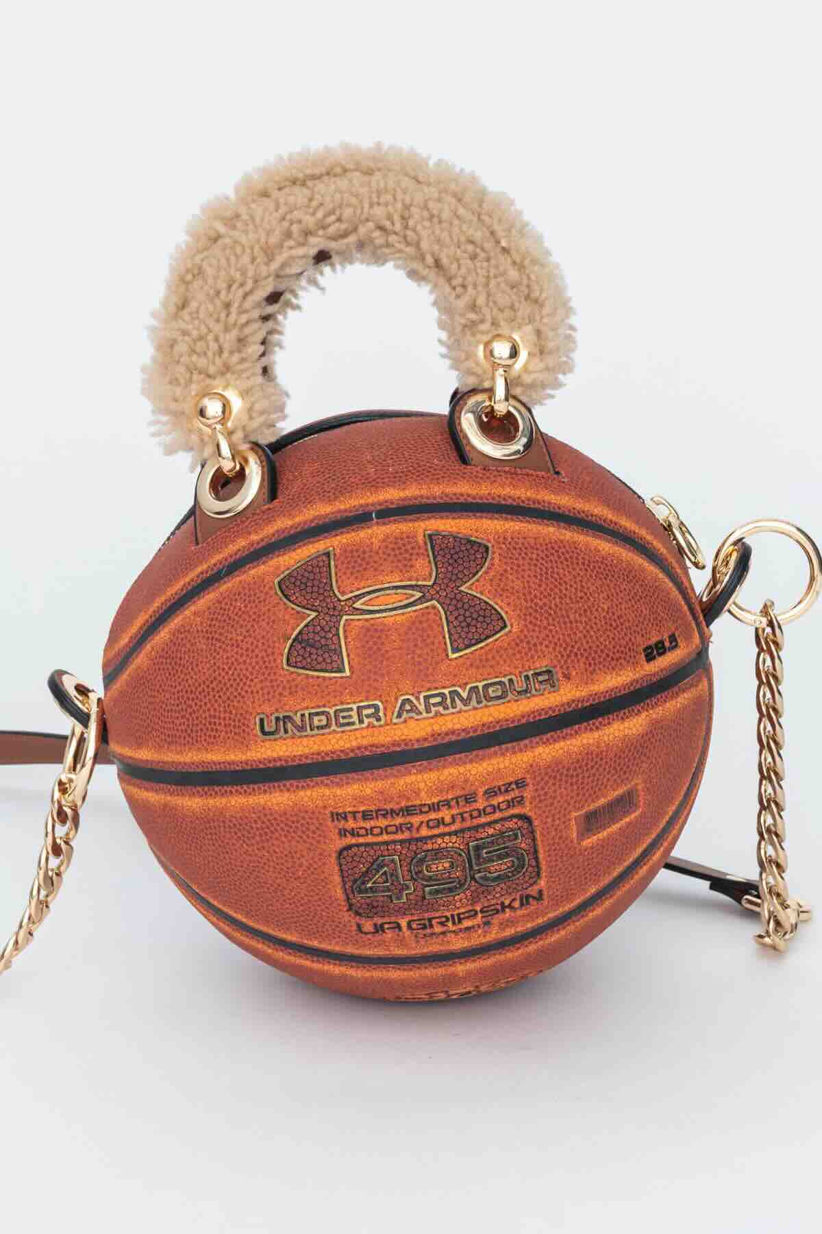 Andrea Bergart, Untitled, 2025. Vintage basketball with shearling sheepskin–lined leather handles and adjustable shoulder pad strap, high-quality finish findings, Italian metal zipper, and durable black cotton canvas lining. Handmade in NYC and one-of-a-kind, ball approximately 29 1/2 in (74.9 cm) in circumference