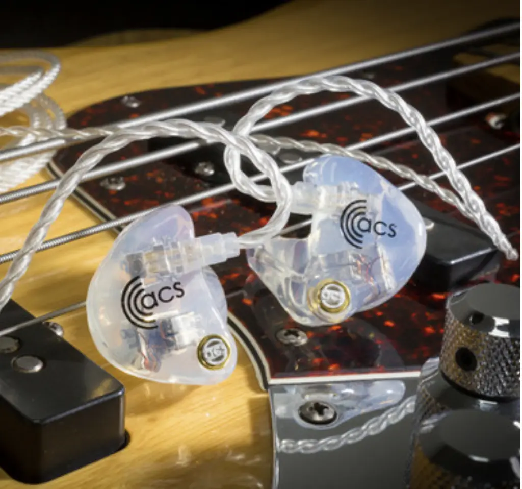 emotion ambient IEM earplugs sitting on guitar