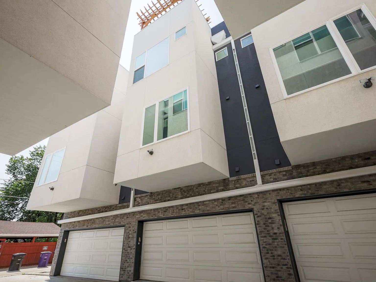Close-up of home exterior showcasing stacked siding, trim details, and large windows
