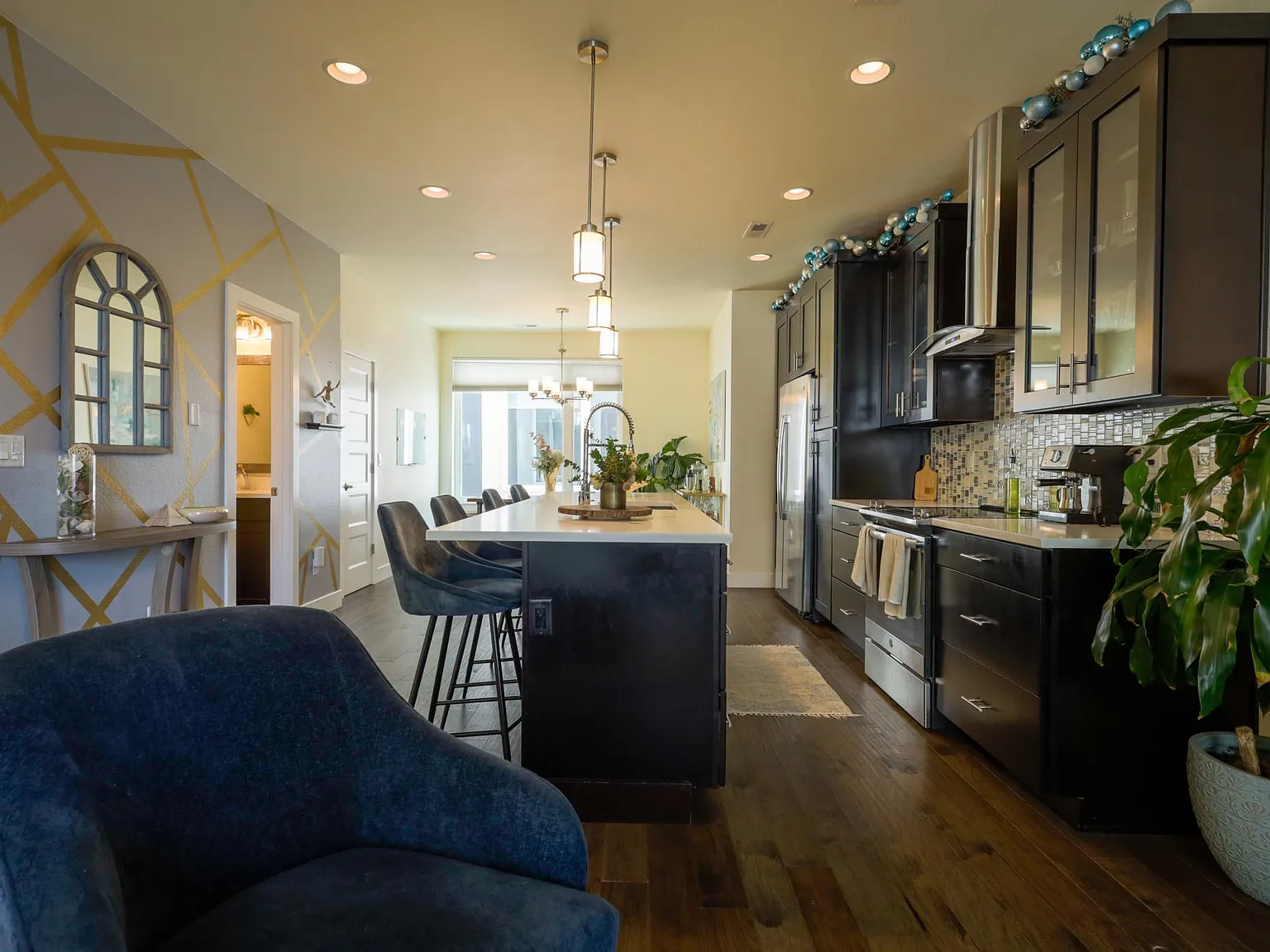 Interior view of kitchen from living space, highlighting layout flow and finishes