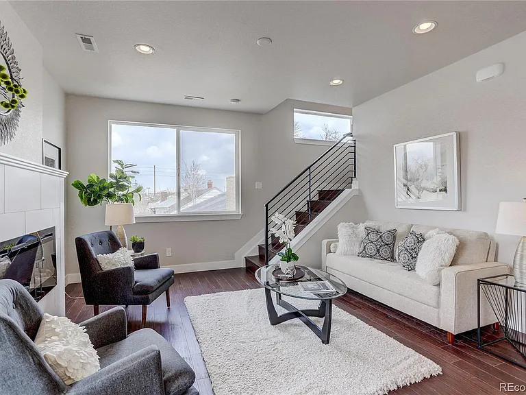 Family room with cozy layout, rug detail, and integrated lighting
