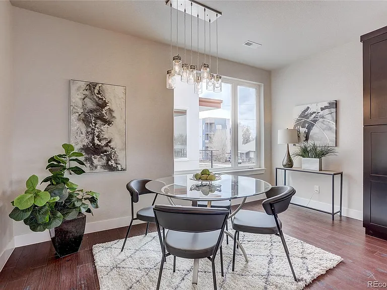 Bright living space with sliding glass doors and indoor plant styling