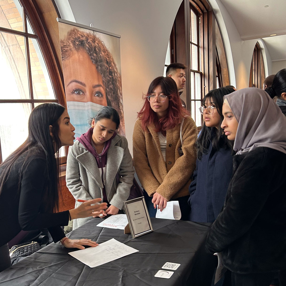 Students at an information booth for Get Ahead in Healthcare