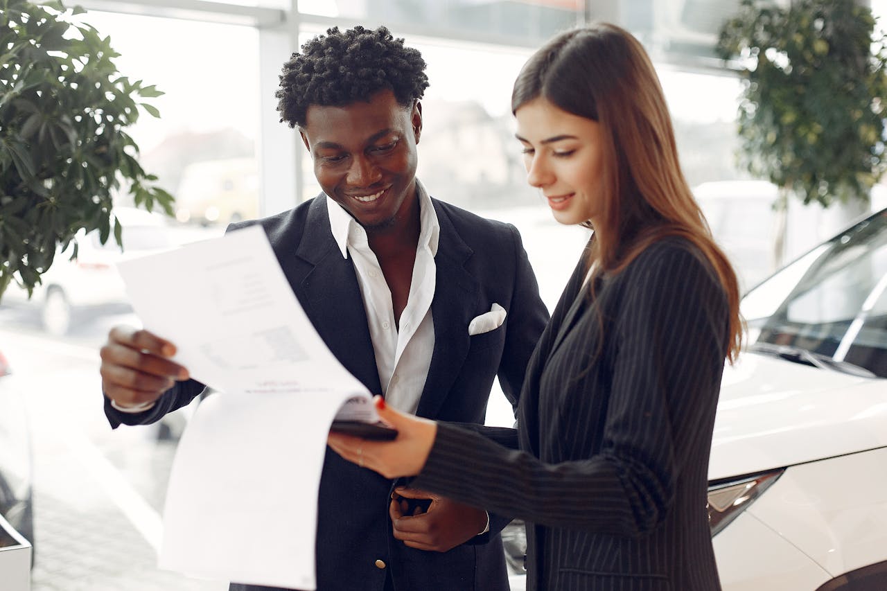 Happy Customer and Agent Reading the Contract