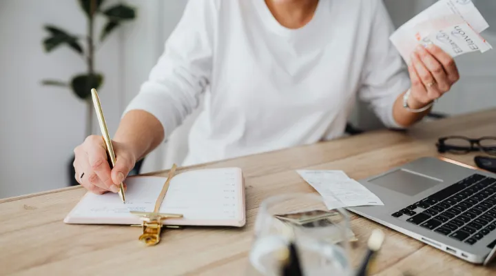 Woman doing taxes at desk