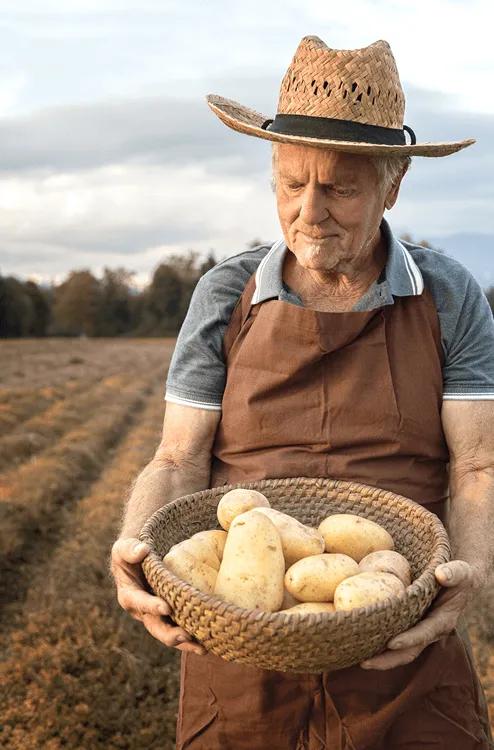A man holding a bag of potatoes