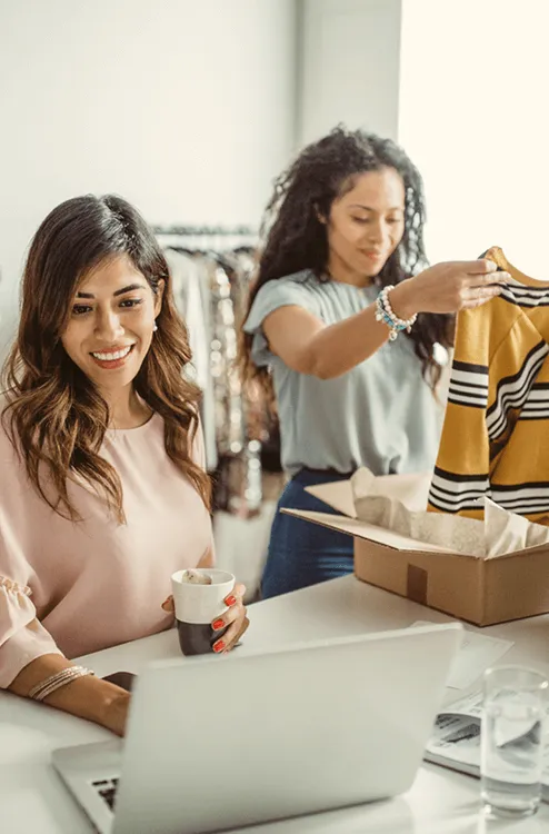 Image of two women preparing a order