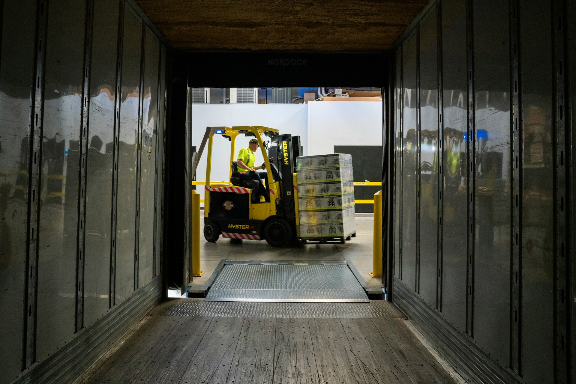 Man lifting boxes using forklift