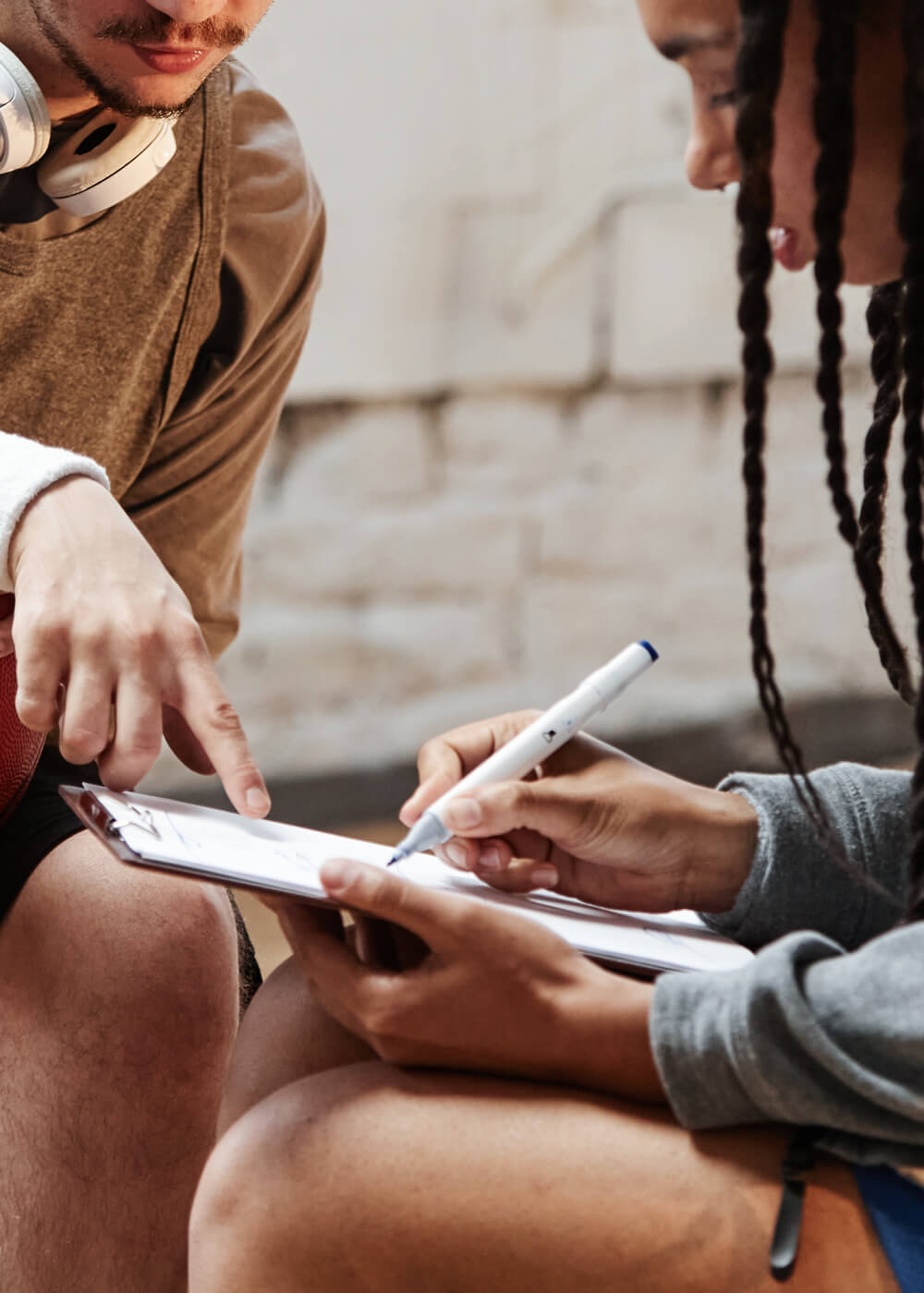 Two person having a discussion and working on some document