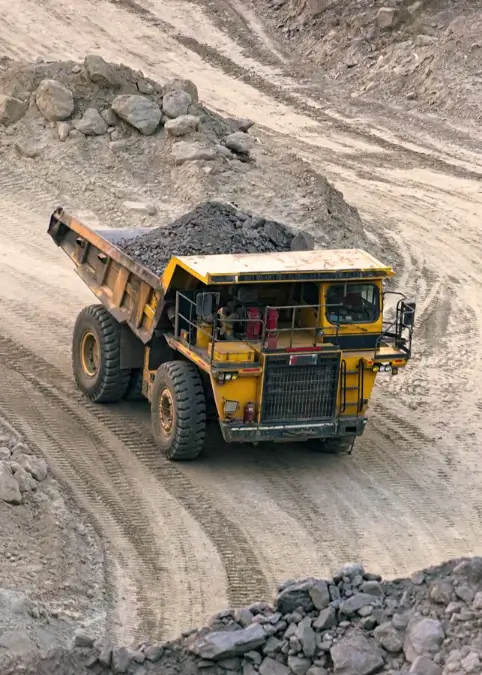 Heavy machinery dump truck transporting gravel on a construction site, illustrating the importance of financing for essential equipment in small businesses.
