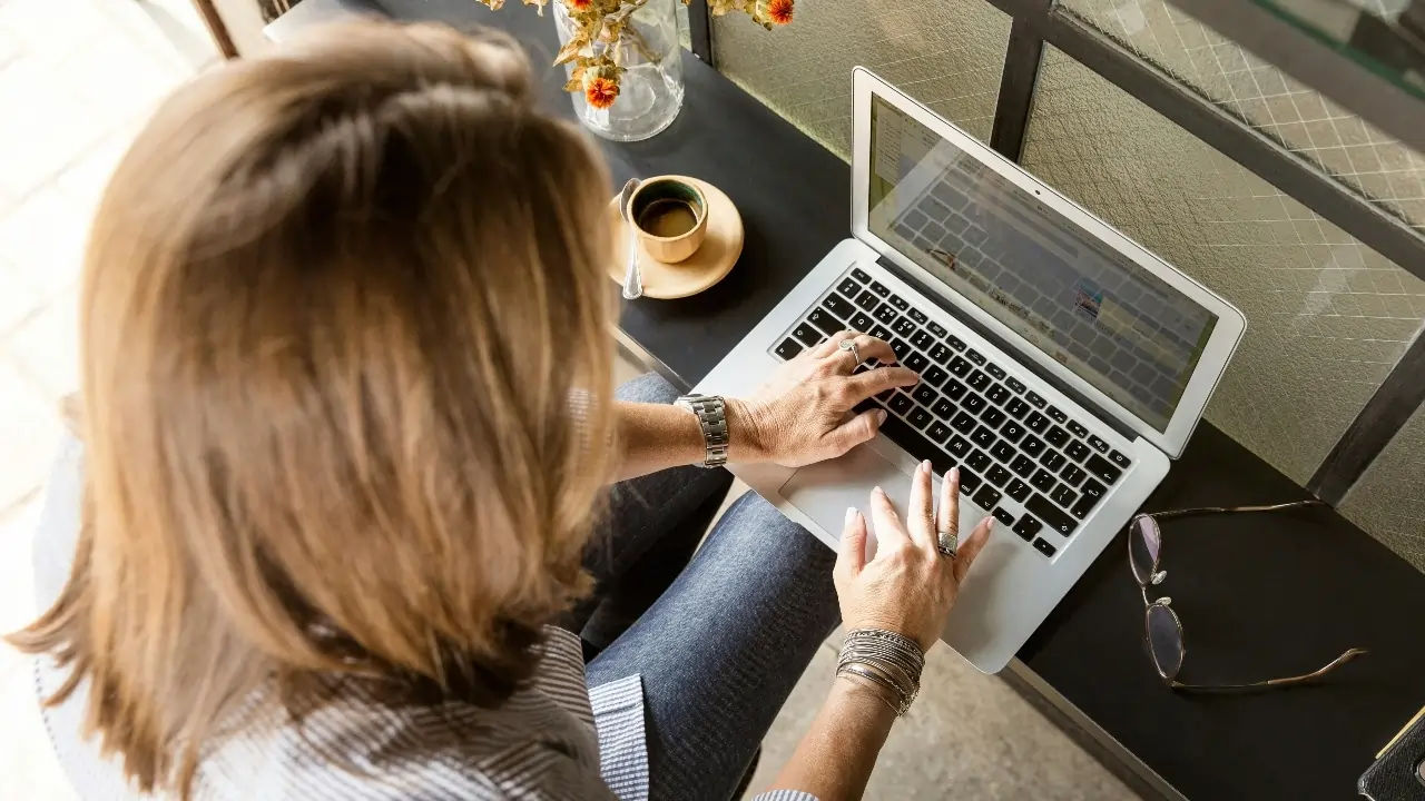 Woman typing on her laptop