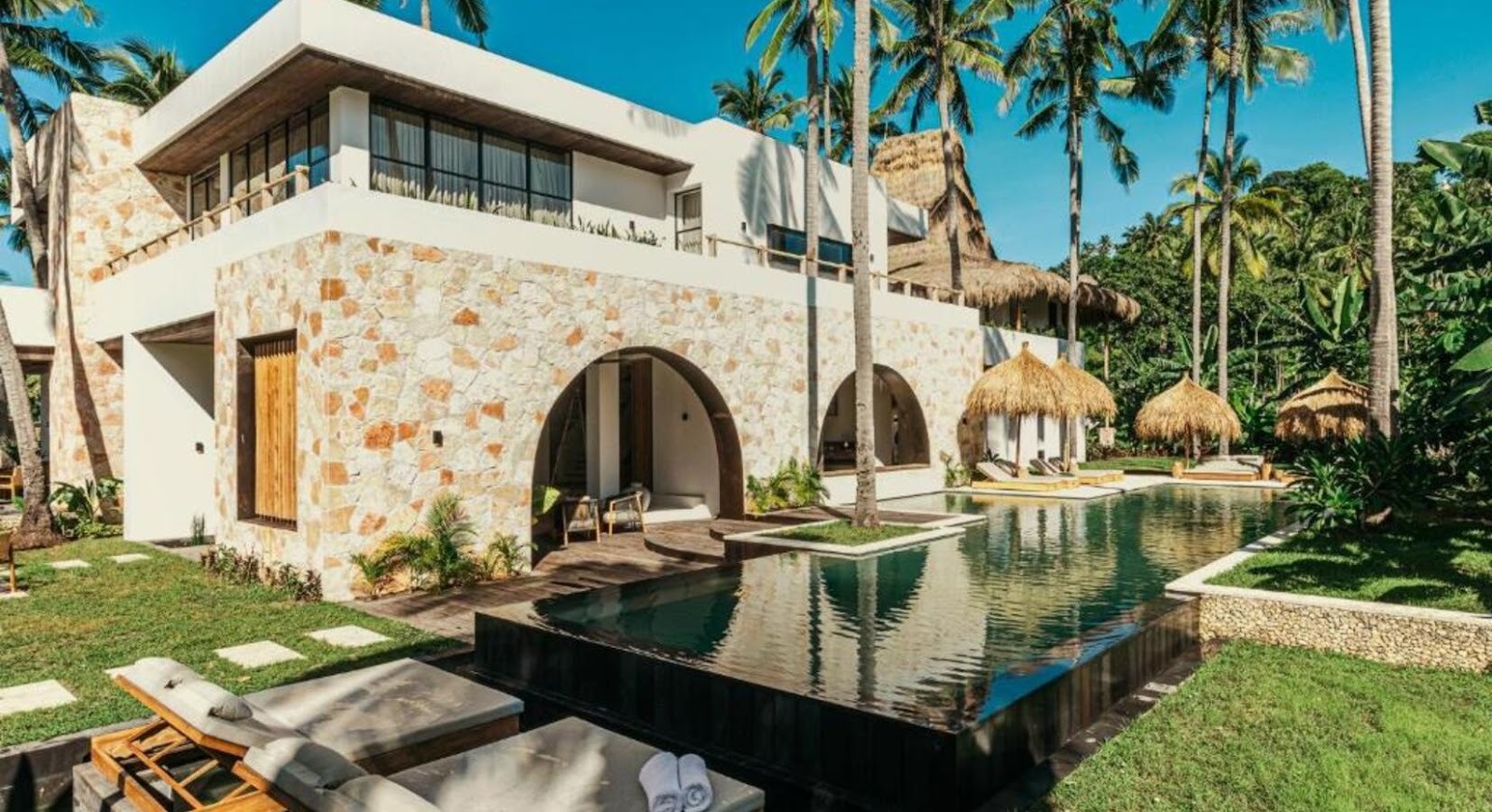 Boutique coastal villa at Alamayah with a private pool and green tropical surroundings in Sumba.