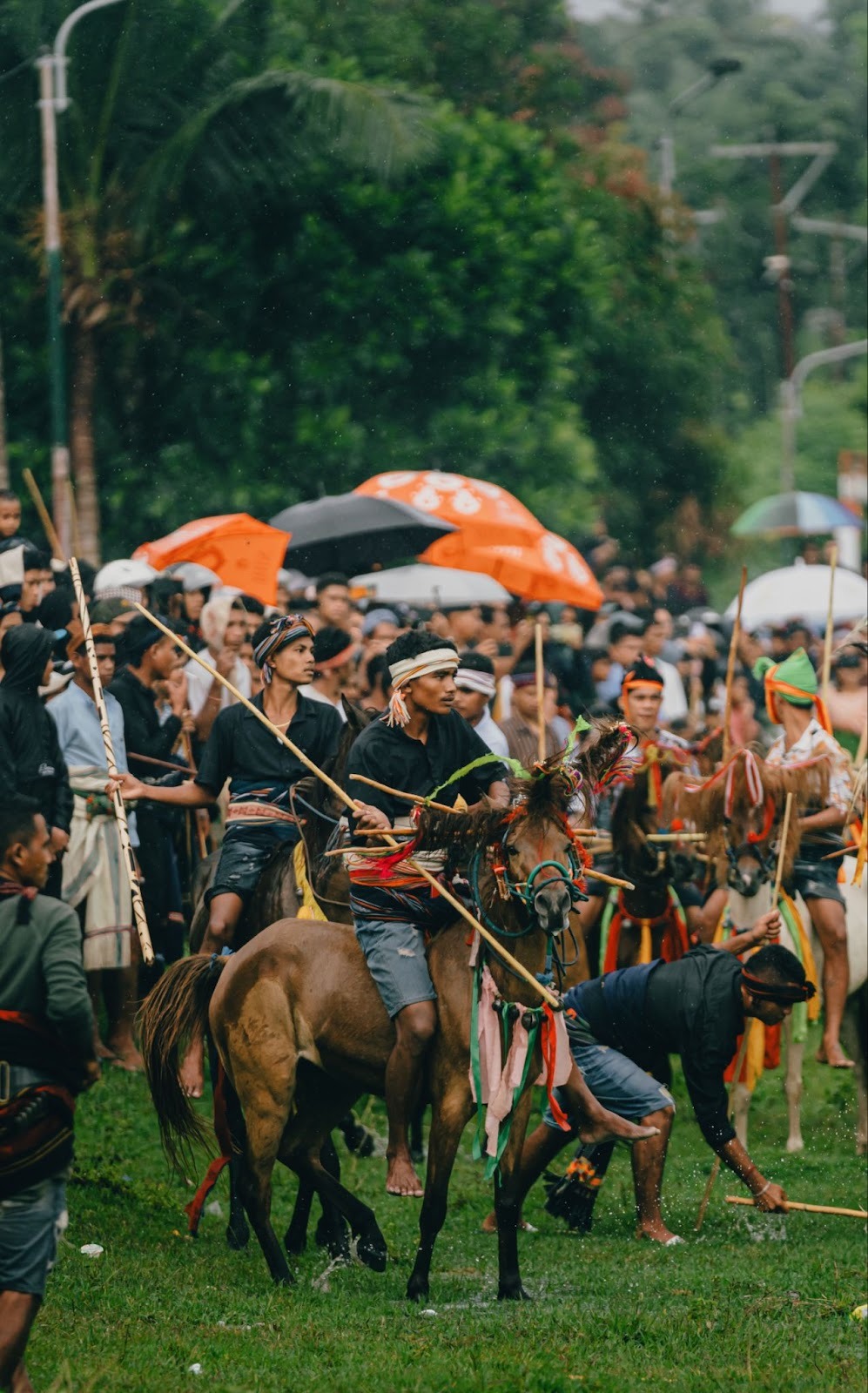 Traditional Pasola horseman wearing ikat textiles and ceremonial headdress during West Sumba cultural festival