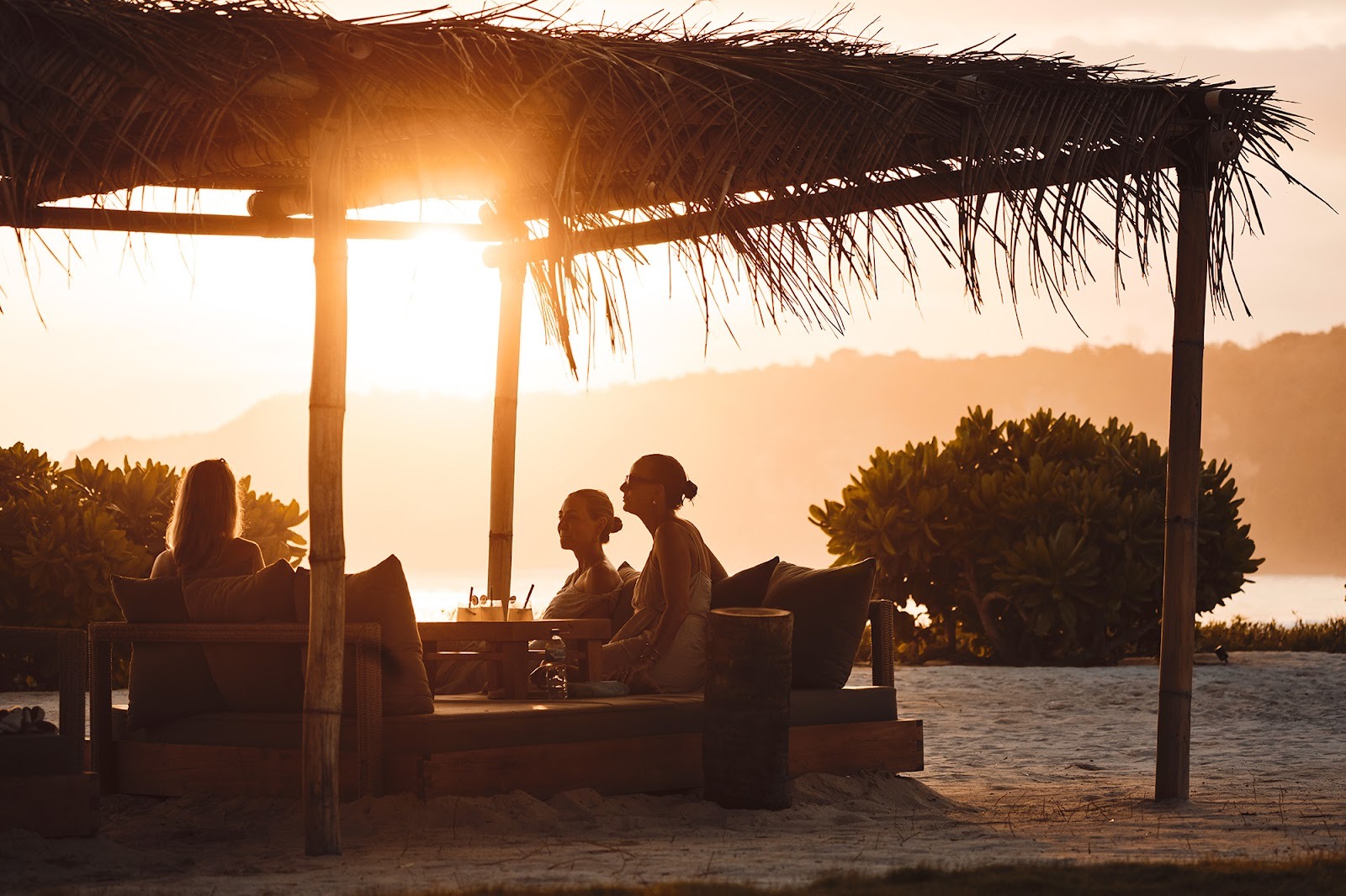 Sunset lounge setting in Sumba designed for mindful, low-alcohol travel and deep connection