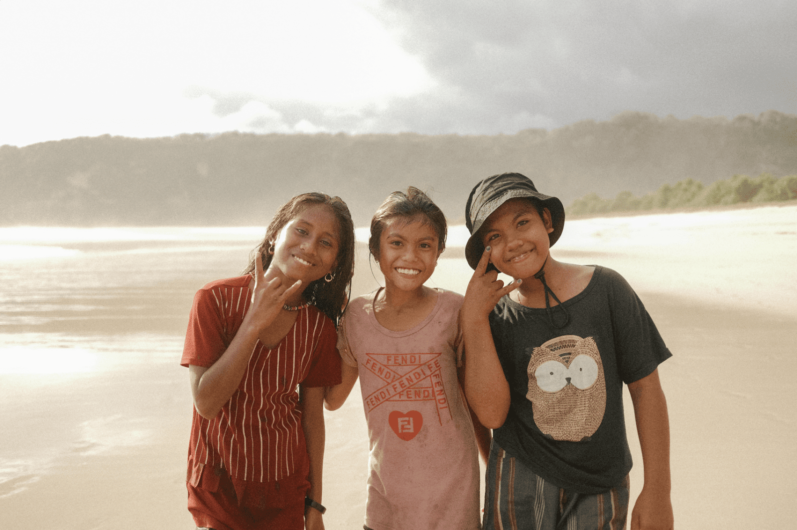 Smiling children on Sumba beach reflecting meaningful Sumba Island travel experiences connected to local communities