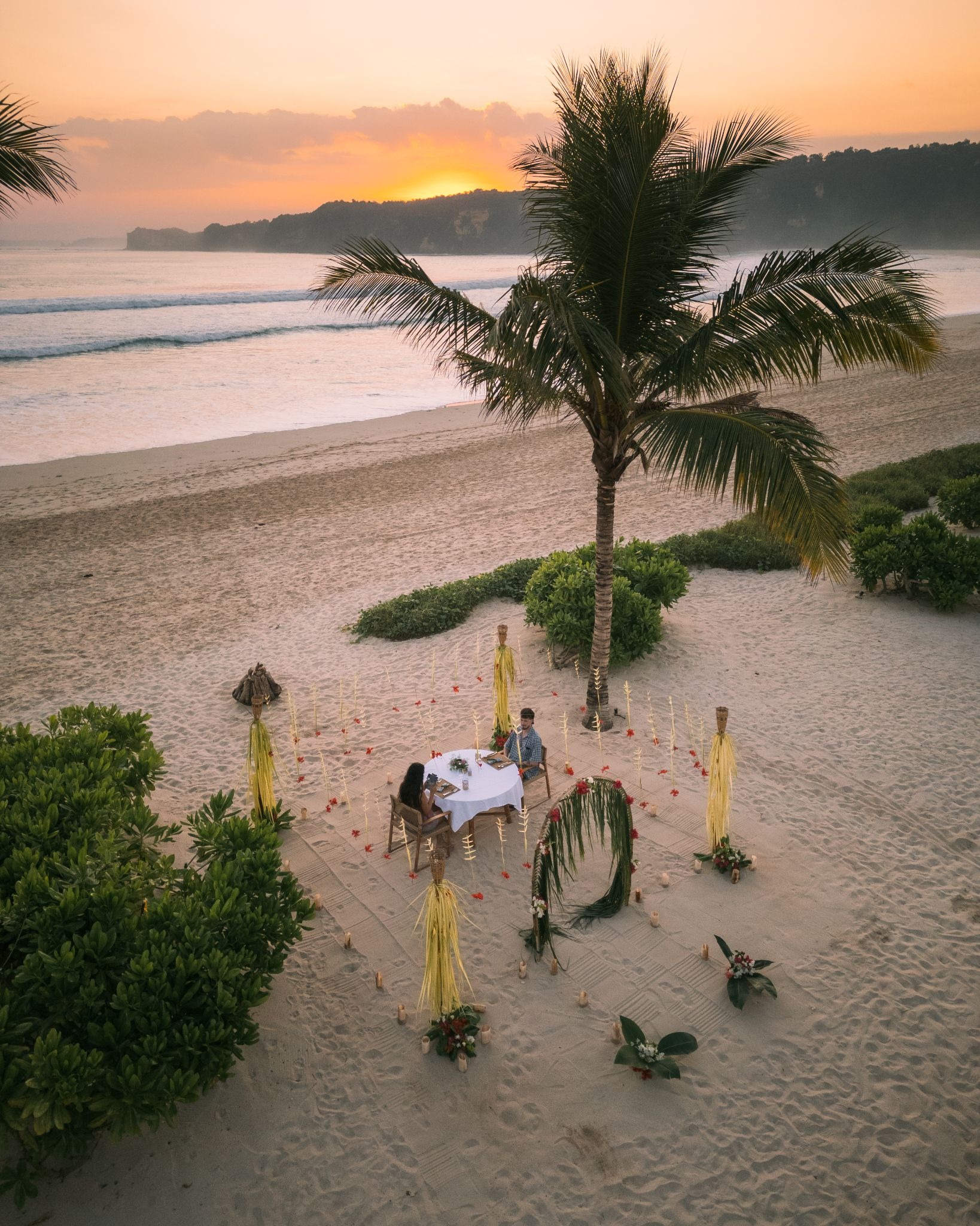 Private romantic sunset beach dinner setup at The Sanubari Sumba island hotel Dassang Beach West Sumba