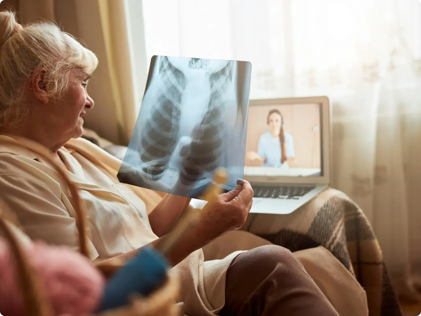 Closeup man having a video call with his doctor evening home