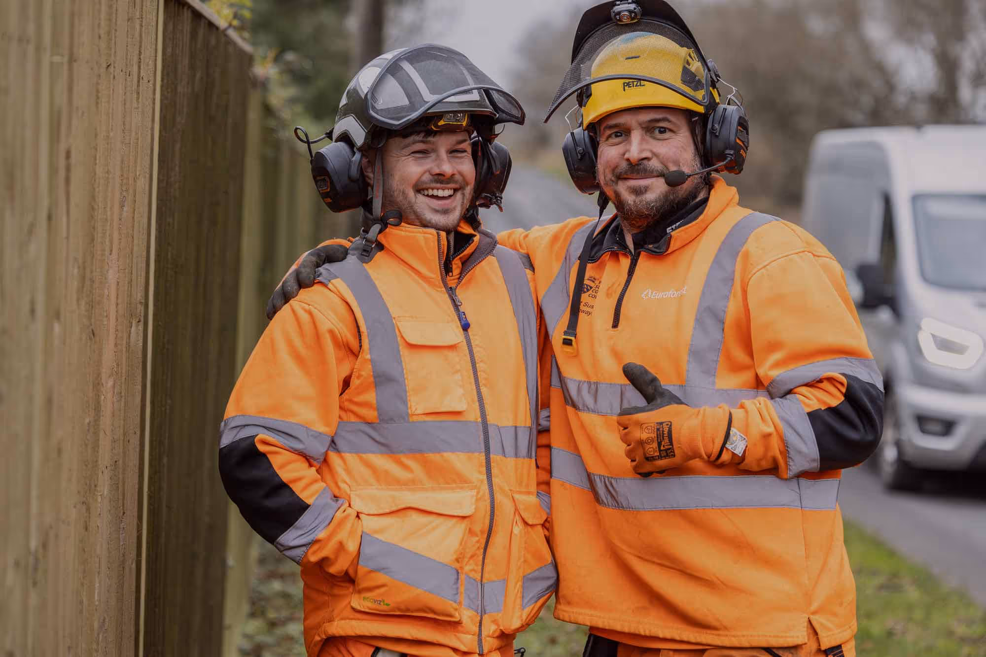 Two good humoured friendly forest workers