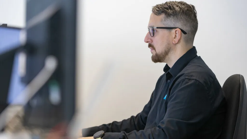 Shape engineer working at a CAD workstation