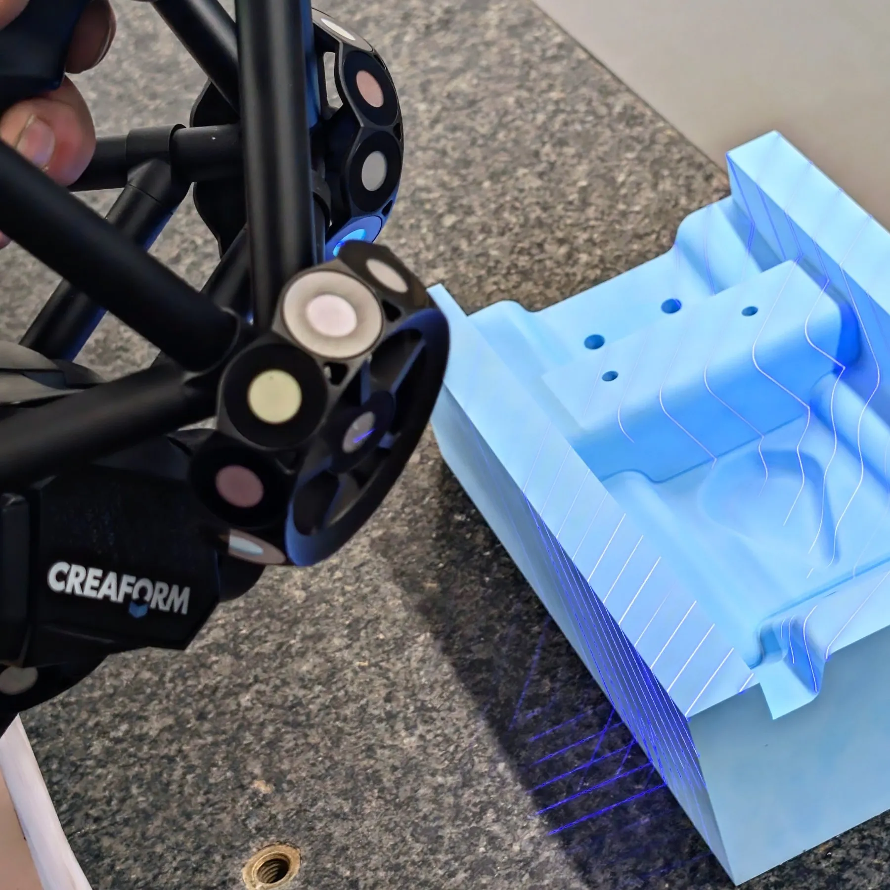 Creaform MetraSCAN BLACK|Elite scanning a machined tooling board pattern at Shape