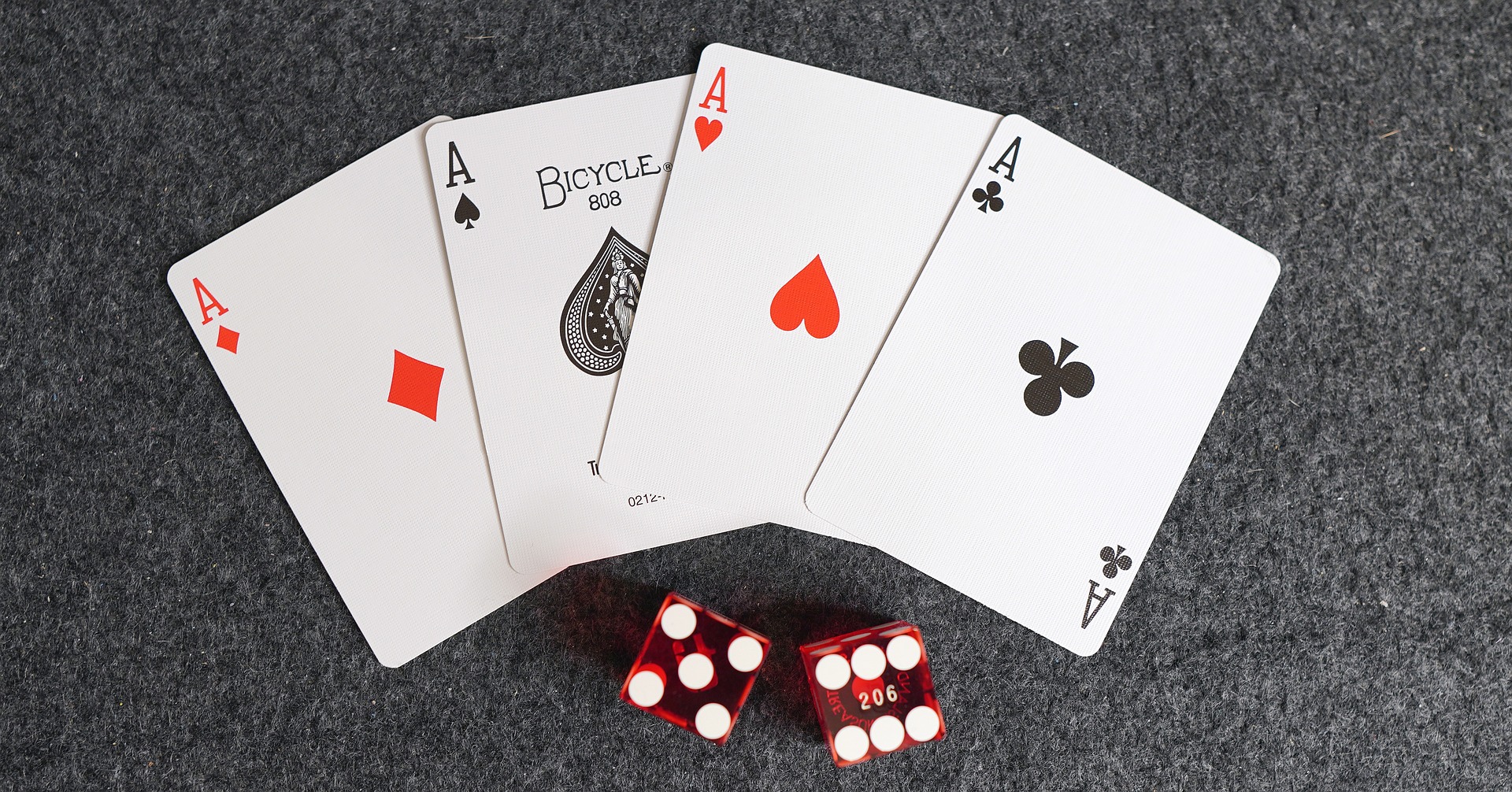 Four aces from a deck of playing cards, ready for a card drinking game