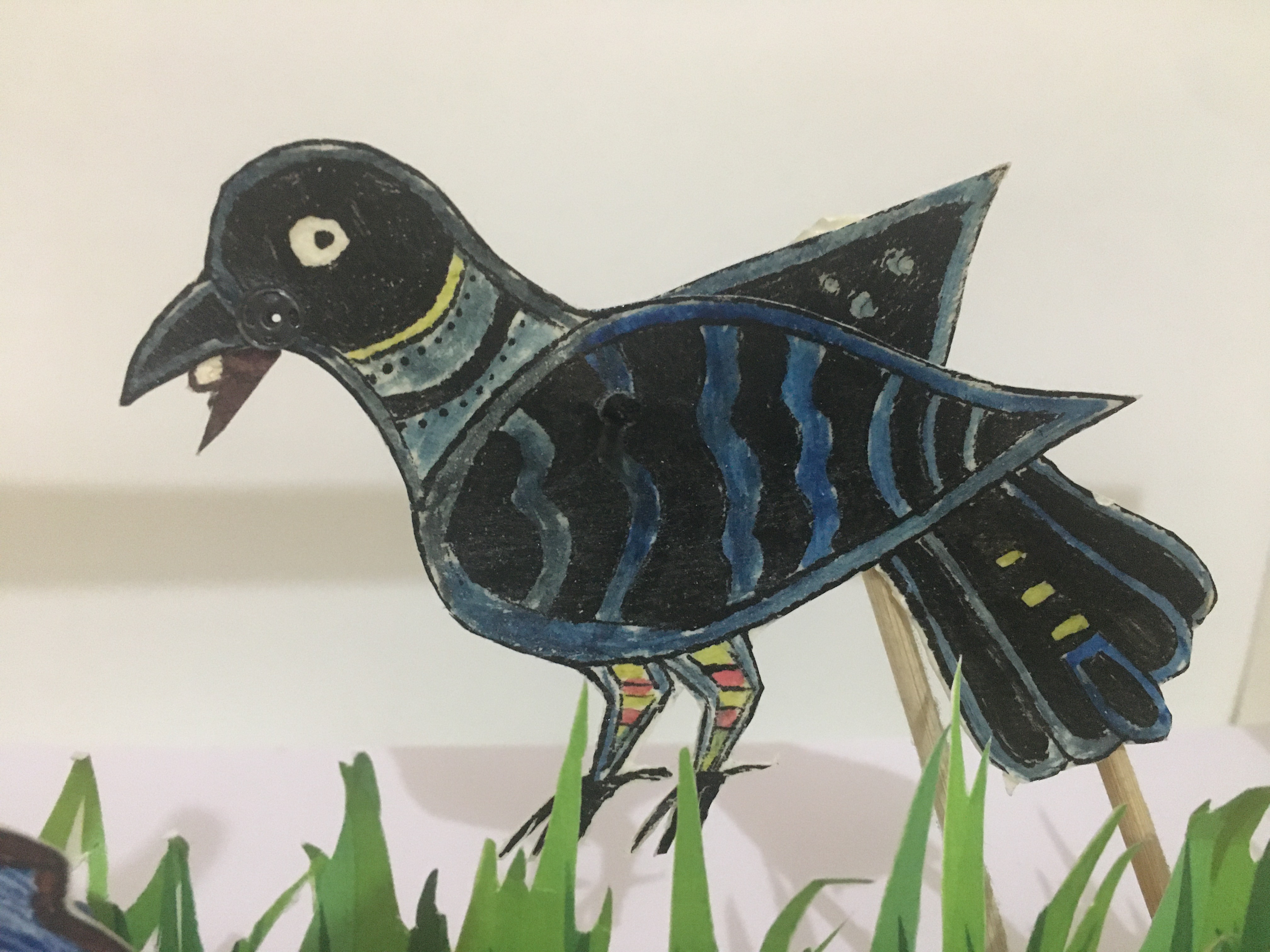 An image of a crow puppet made of leather parchment