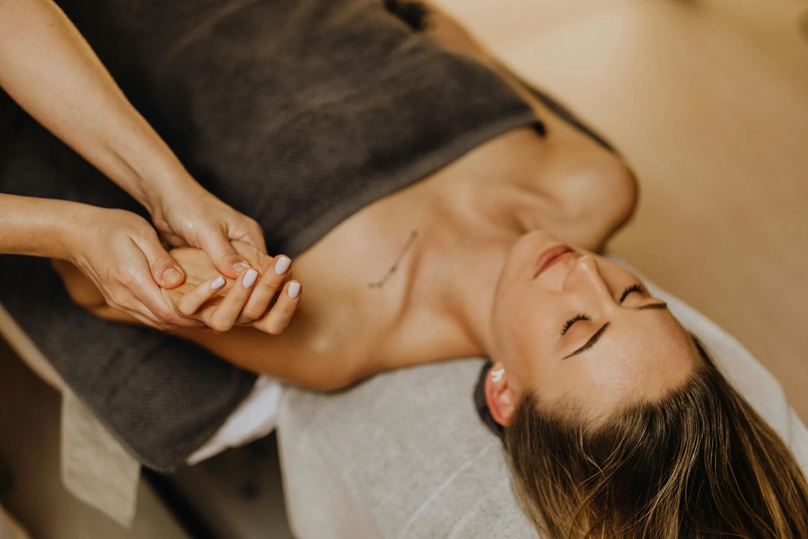 A woman getting a massage at a spa.