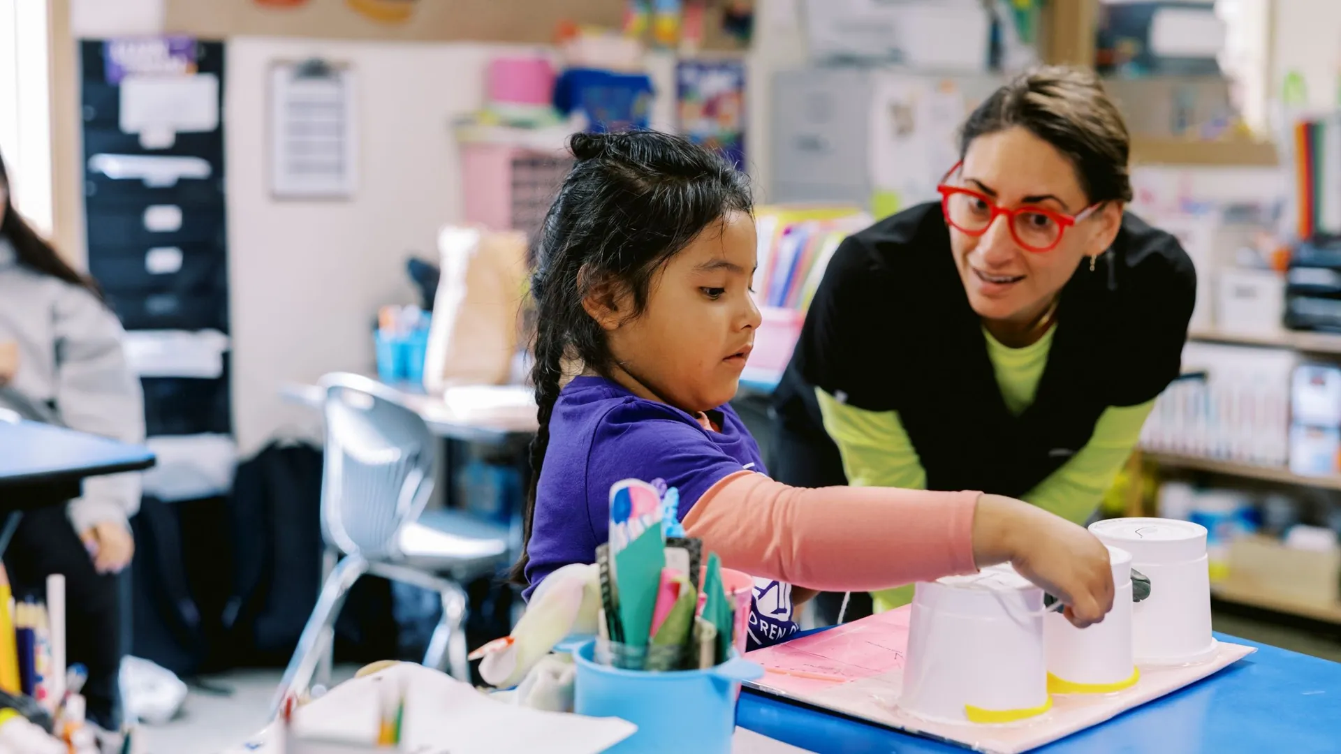 Children of the Valley staff working with child during photoshoot | Baylii Branding