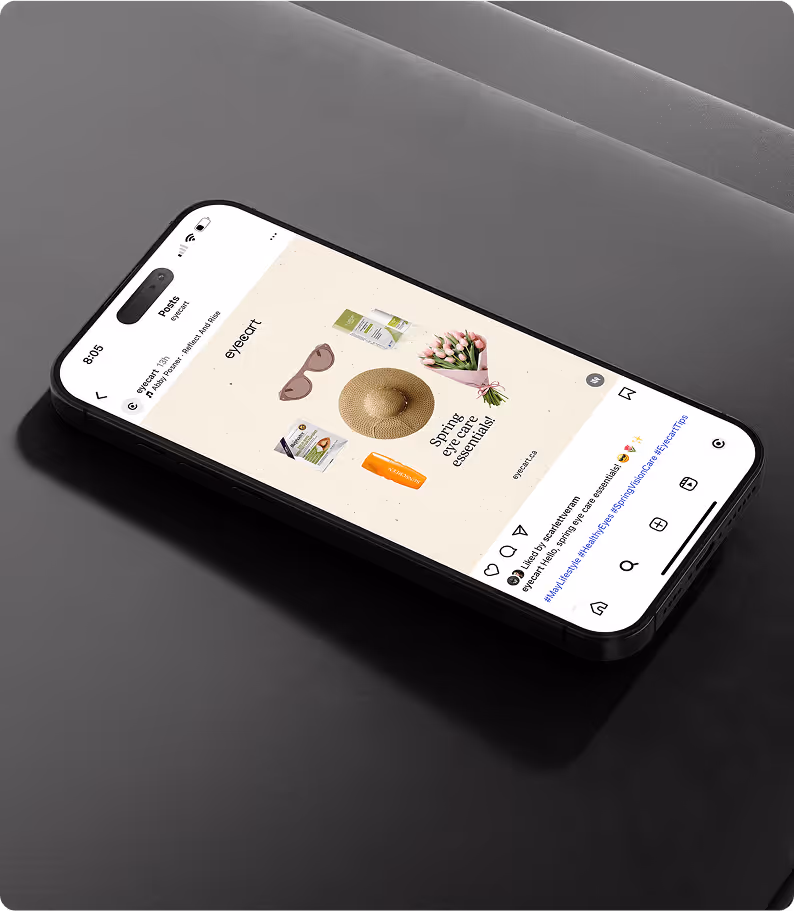 smartphone screen displays an Instagram post from Eyecart featuring a flat lay of spring essentials, including sunglasses, a straw hat, tulips, and wellness products, with the caption “Spring eye care essentials.”