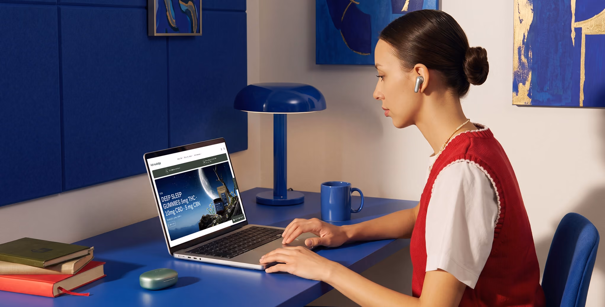 Professional using a laptop to manage a Shopify ecommerce store, showcasing Shopify website development and online store optimization in a modern workspace.