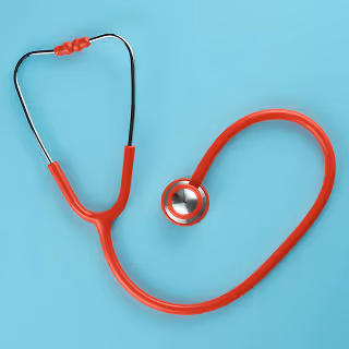 A red stethoscope placed on a light blue background, arranged in a heart-like shape to signify care and health services.