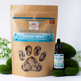 Packaged chicken dog treats and CBD oil bottle displayed on moss with a white background.