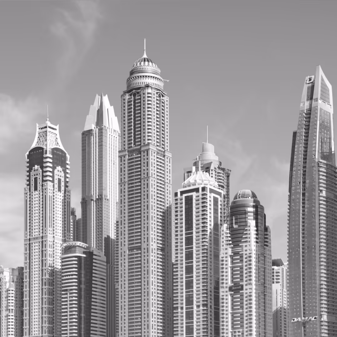 Close-up of distinctive Dubai Marina skyscrapers, showcasing varied architectural designs and sleek glass facades.
