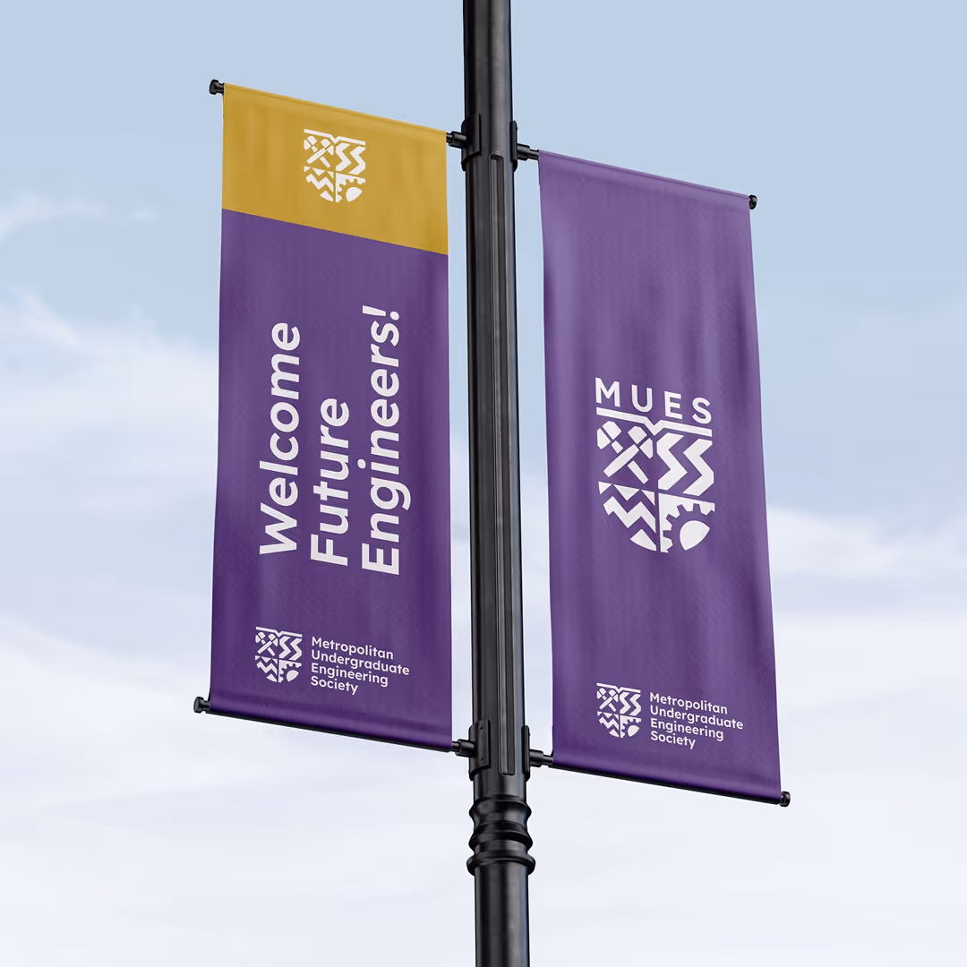 Vertical street banners in purple and gold for the Metropolitan Undergraduate Engineering Society with the message “Welcome Future Engineers!”