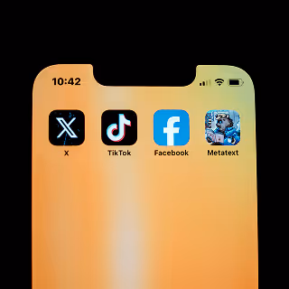 Smartphone home screen showing the icons for social media apps including X, TikTok, Facebook, and Metatext on a warm gradient background.