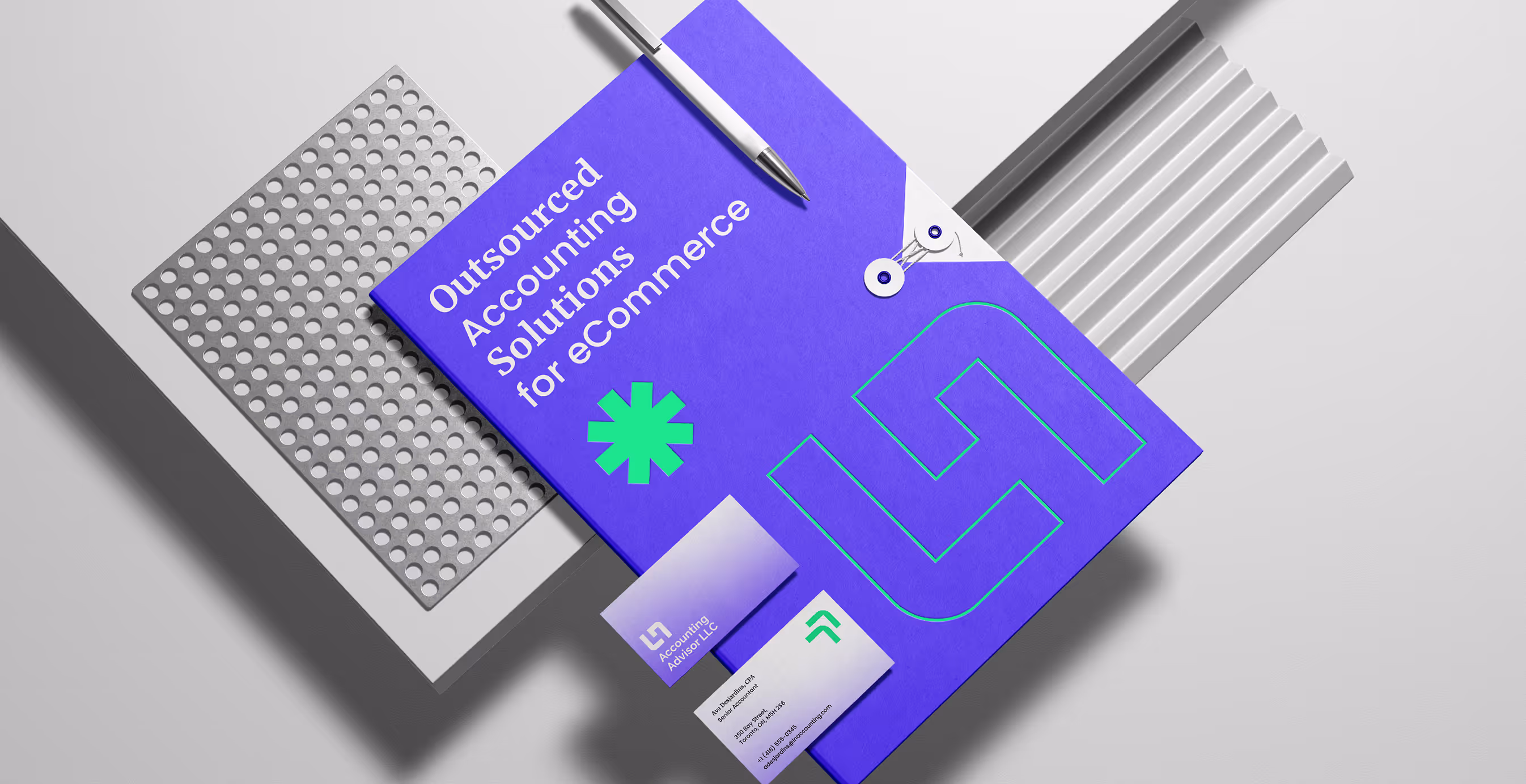 Branded LN Accounting folder in vibrant purple with green geometric accents, accompanied by a sleek silver pen and business cards showcasing the modern logo and contact details.