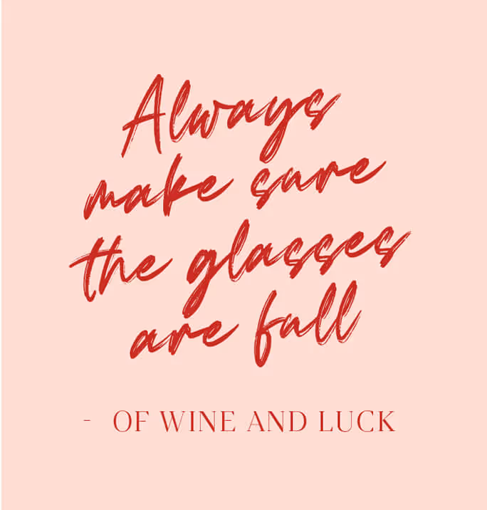 Pink square with red handwritten text that reads “Always make sure the glasses are full – of wine and luck.”