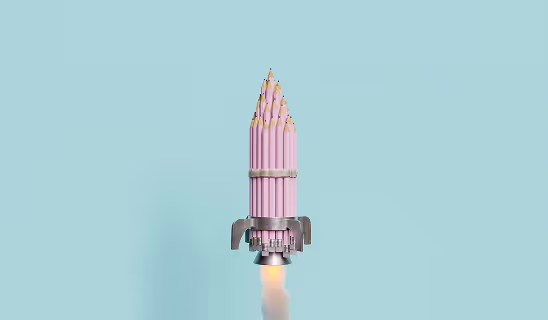 Conceptual image of a rocket made from pink pencils taking off against a light blue background.