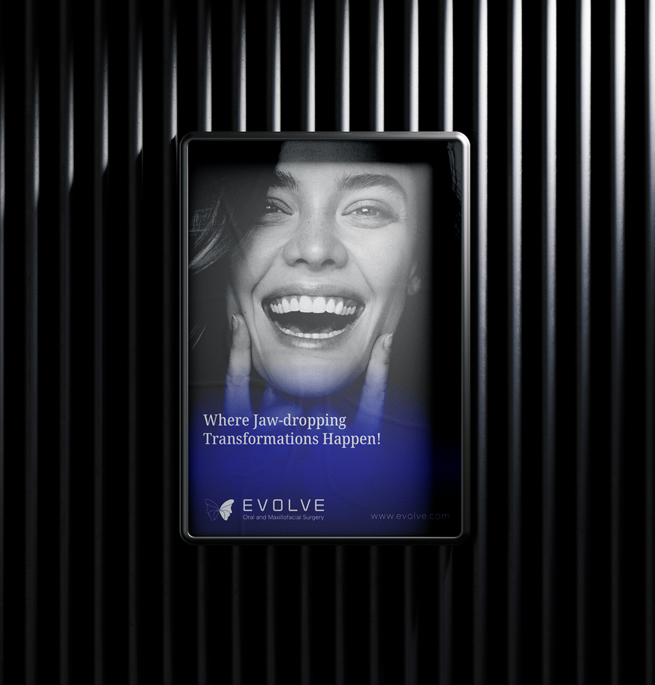 Backlit poster featuring a smiling woman with the tagline “Where Jaw-dropping Transformations Happen!” and the Evolve logo on a black background.